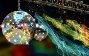 Two glittering disco balls with fluorescent streaks of color nearby